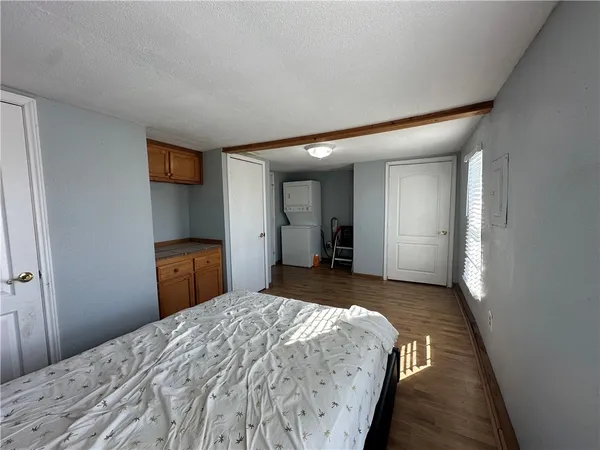 a bedroom with a bed and a mirror