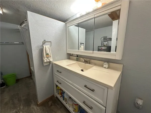 a bathroom with a sink and mirror