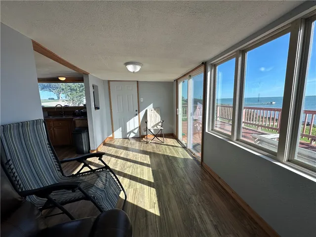 a view of a livingroom with furniture window and wooden floor