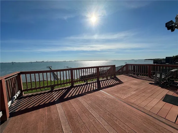 a view of balcony with wooden floor