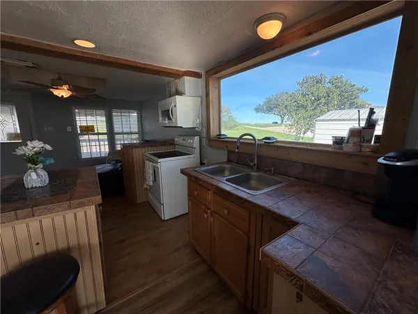 a kitchen with lots of counter top space and sink