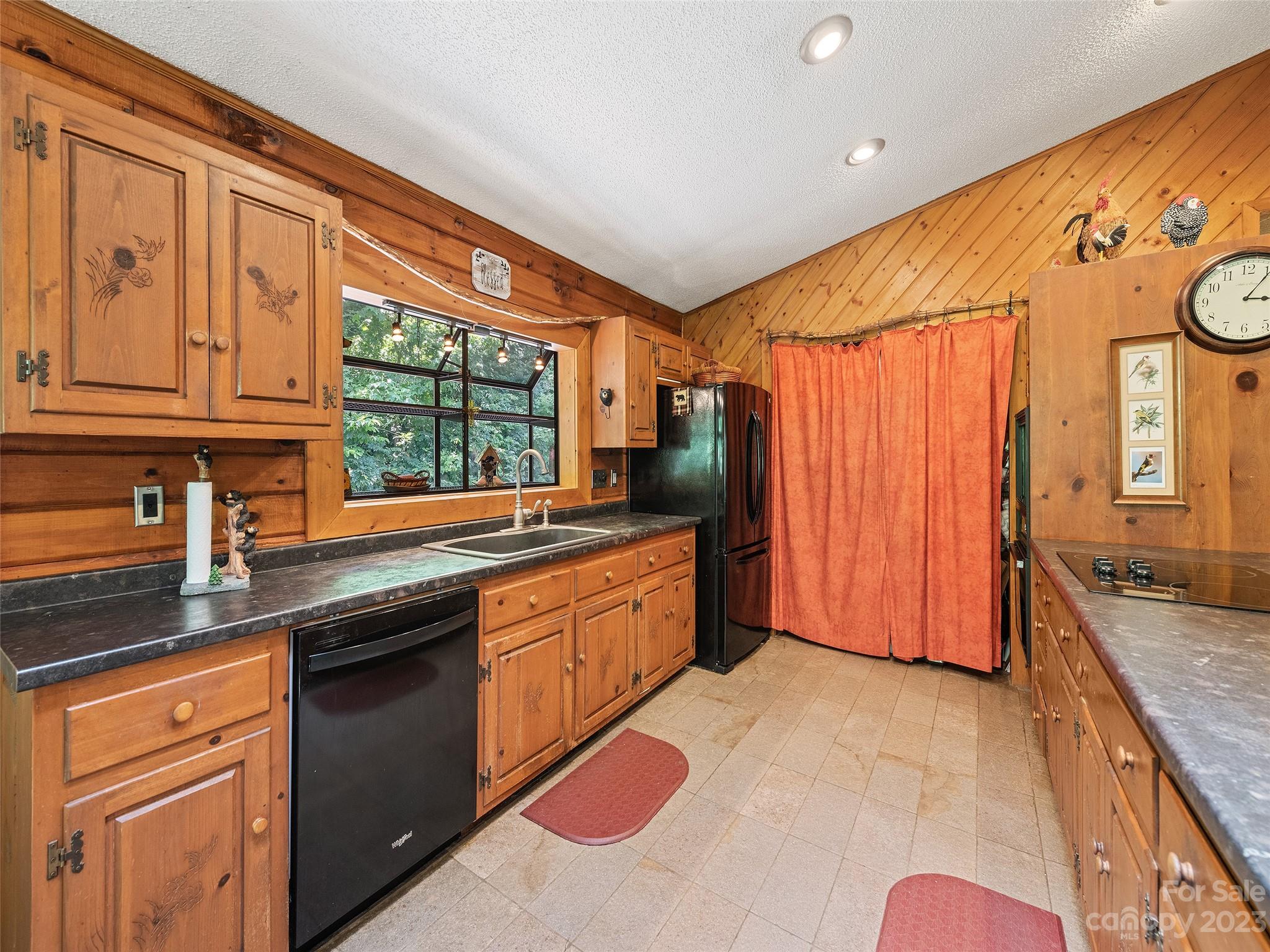 28 Honeybear Lane Clyde, NC 28721 - Photo 15 of 43 a kitchen with stainless steel appliances granite countertop a sink and cabinets