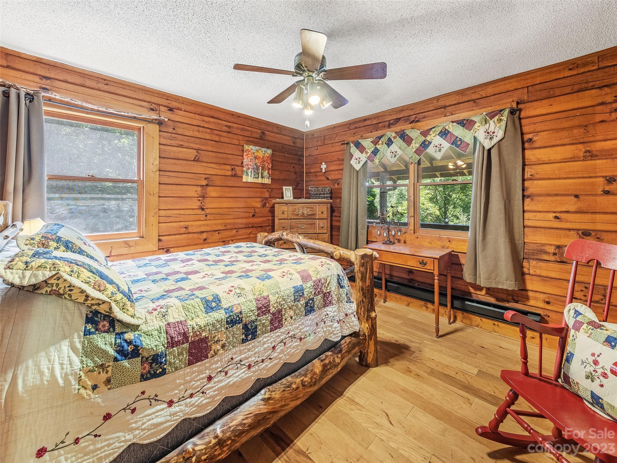 28 Honeybear Lane Clyde, NC 28721 - Photo 19 of 43 a bed sitting in a bedroom next to a window