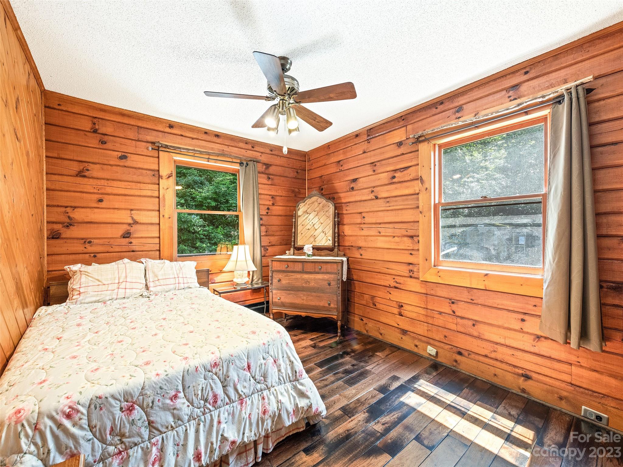 28 Honeybear Lane Clyde, NC 28721 - Photo 21 of 43 a bedroom with a bed and a large window
