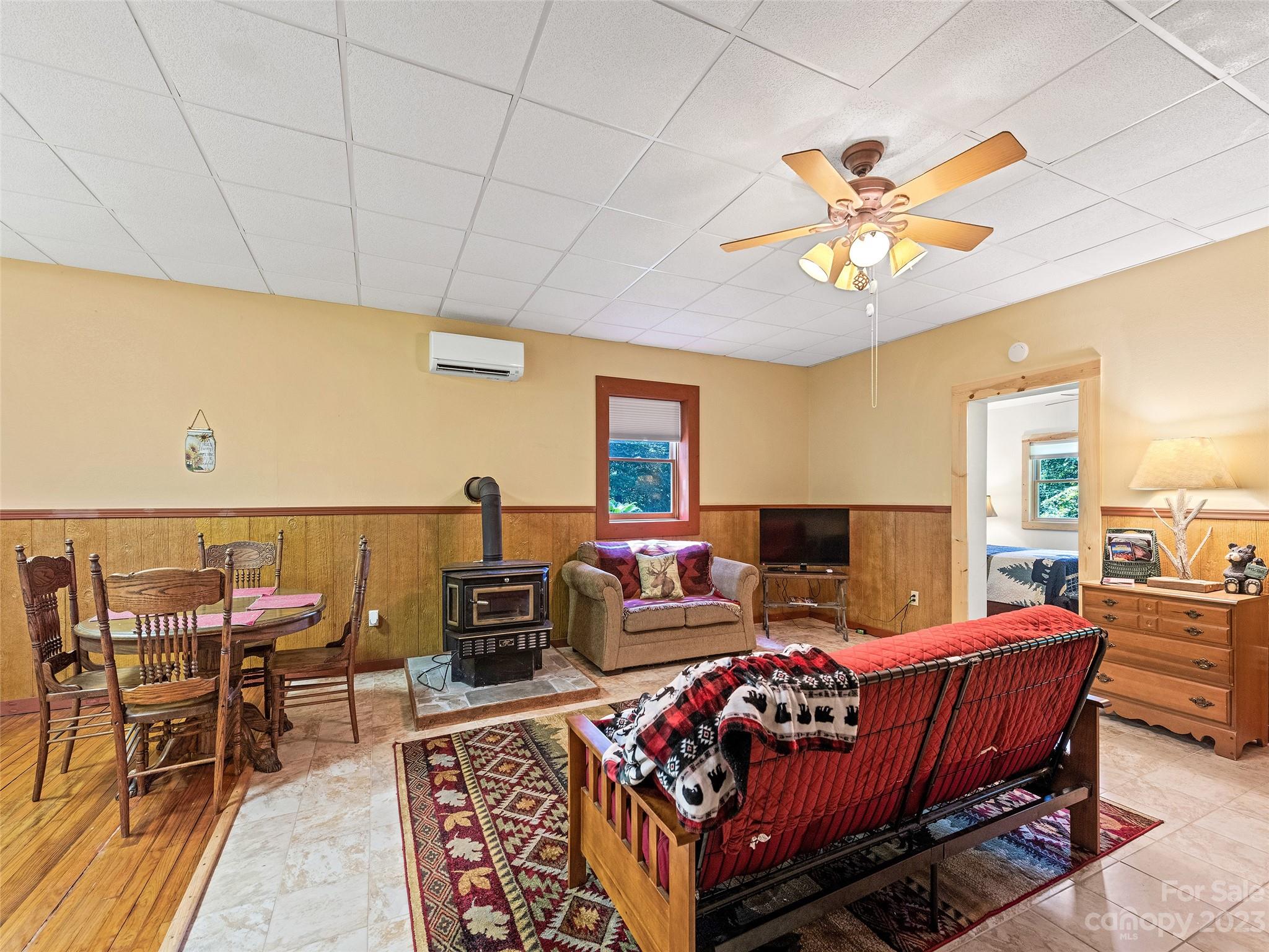 28 Honeybear Lane Clyde, NC 28721 - Photo 25 of 43 a living room with furniture a rug and a chandelier