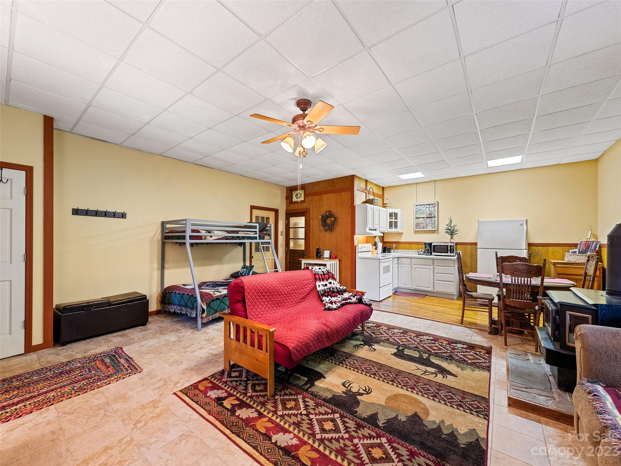 28 Honeybear Lane Clyde, NC 28721 - Photo 26 of 43 a living room with furniture a rug and kitchen view
