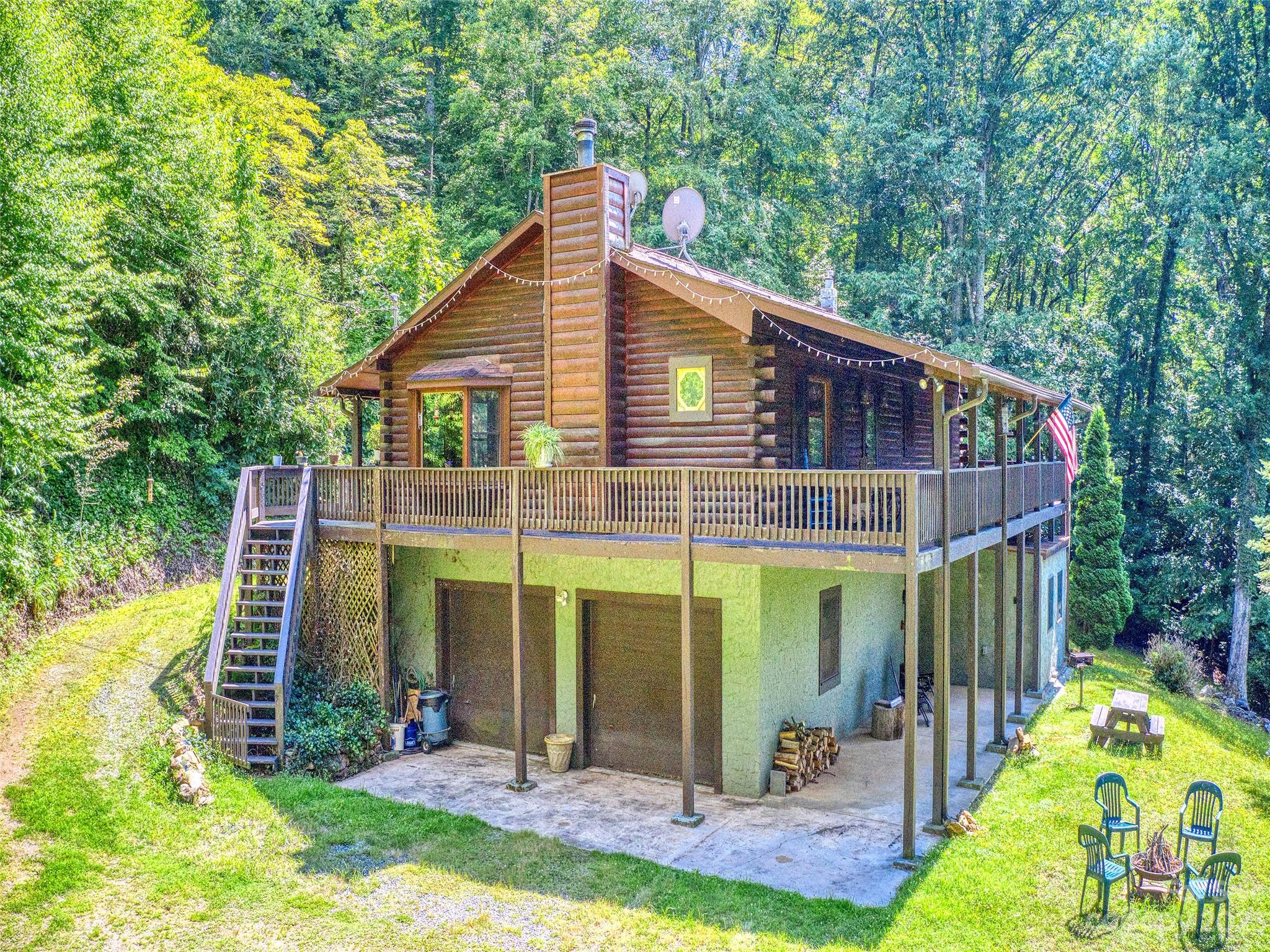 28 Honeybear Lane Clyde, NC 28721 - Photo 3 of 43 a view of a house with a yard and plants