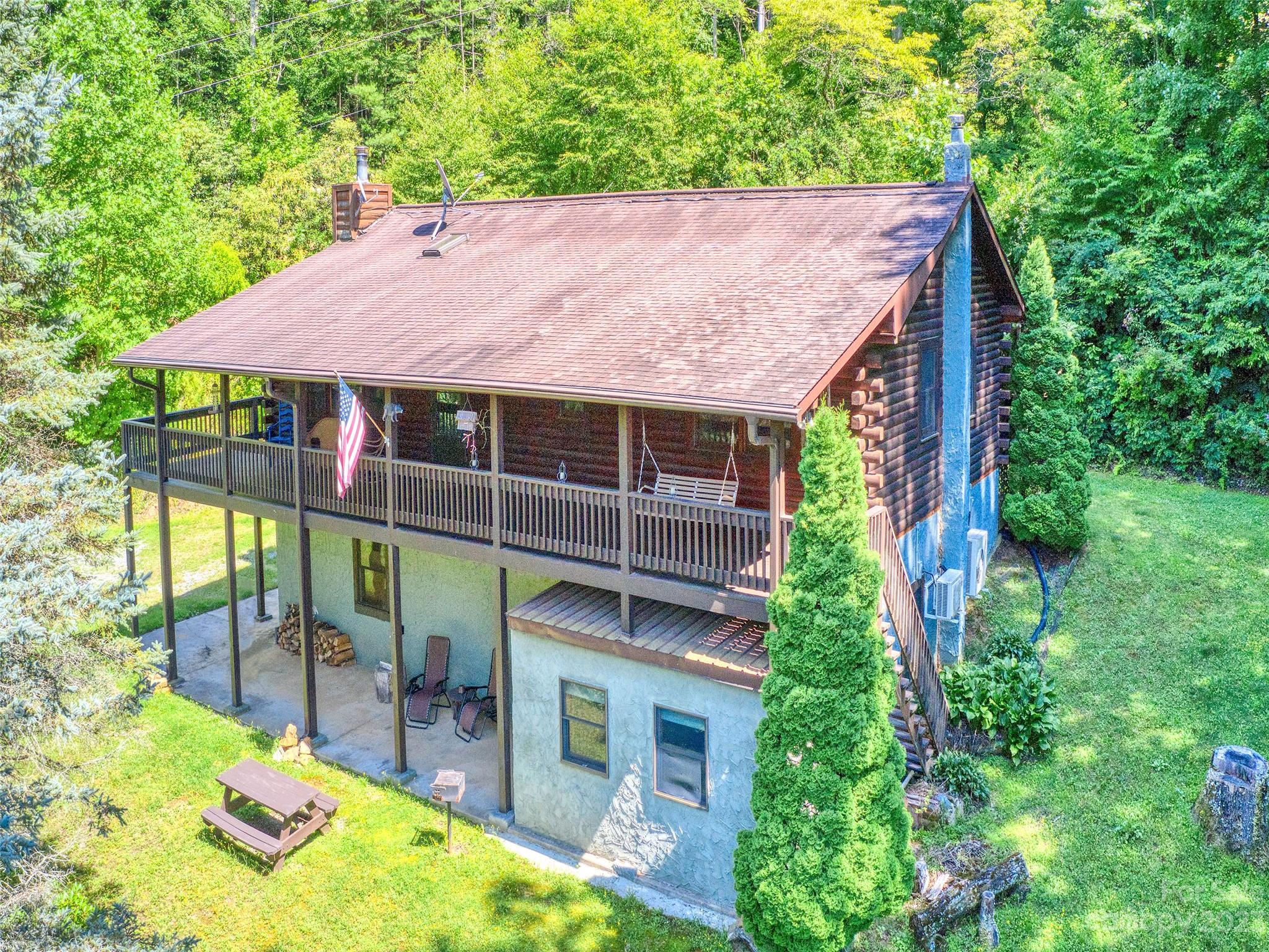 28 Honeybear Lane Clyde, NC 28721 - Photo 33 of 43 a view of a house with a backyard balcony and garden