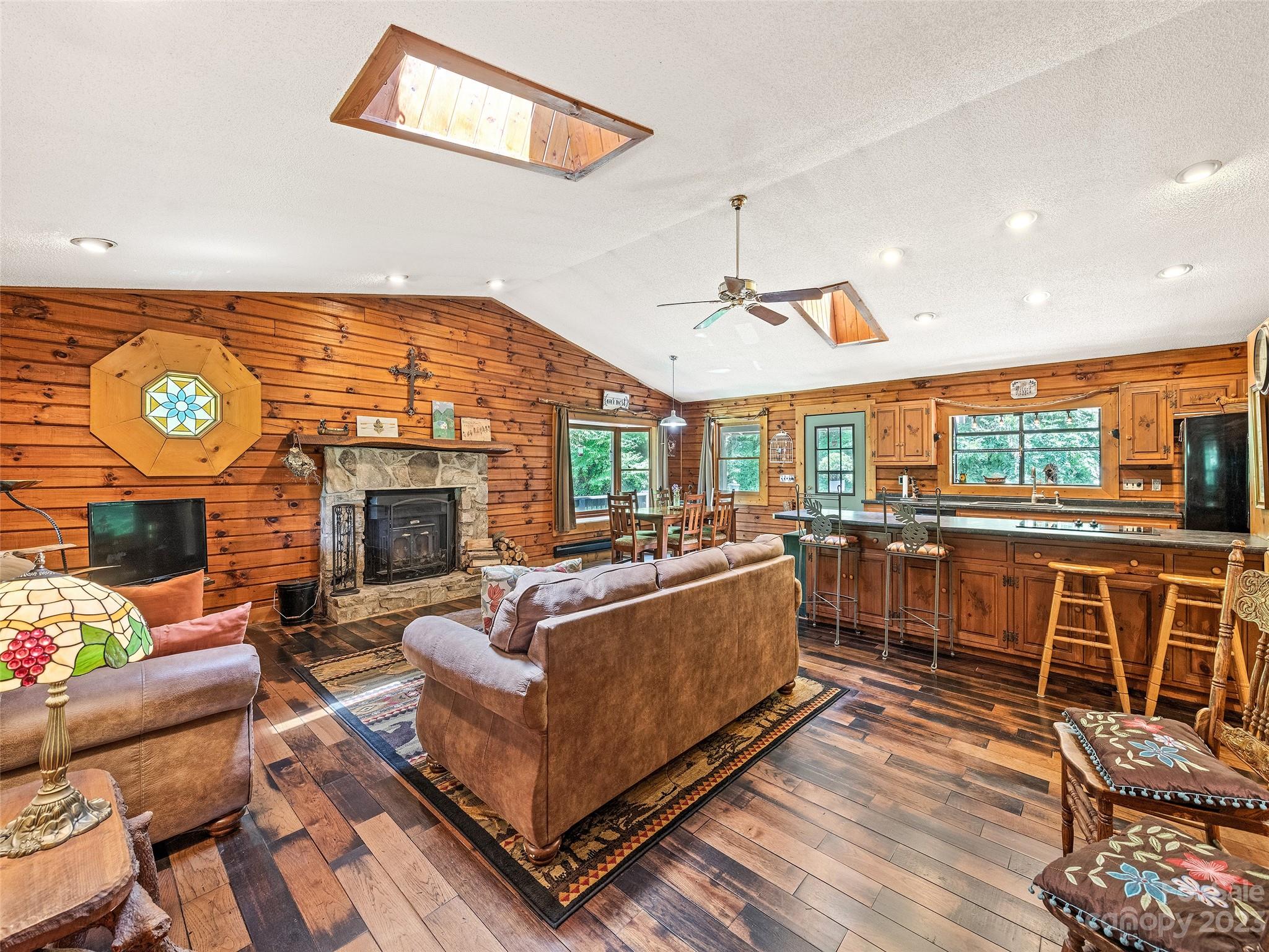 28 Honeybear Lane Clyde, NC 28721 - Photo 6 of 43 a living room with fireplace furniture and a flat screen tv