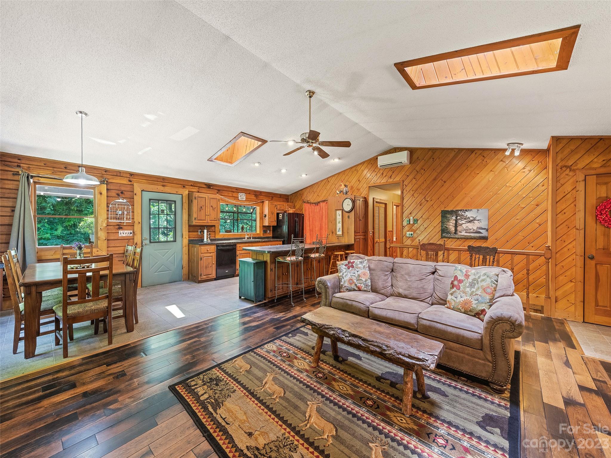 28 Honeybear Lane Clyde, NC 28721 - Photo 9 of 43 a living room with furniture kitchen view and a large window