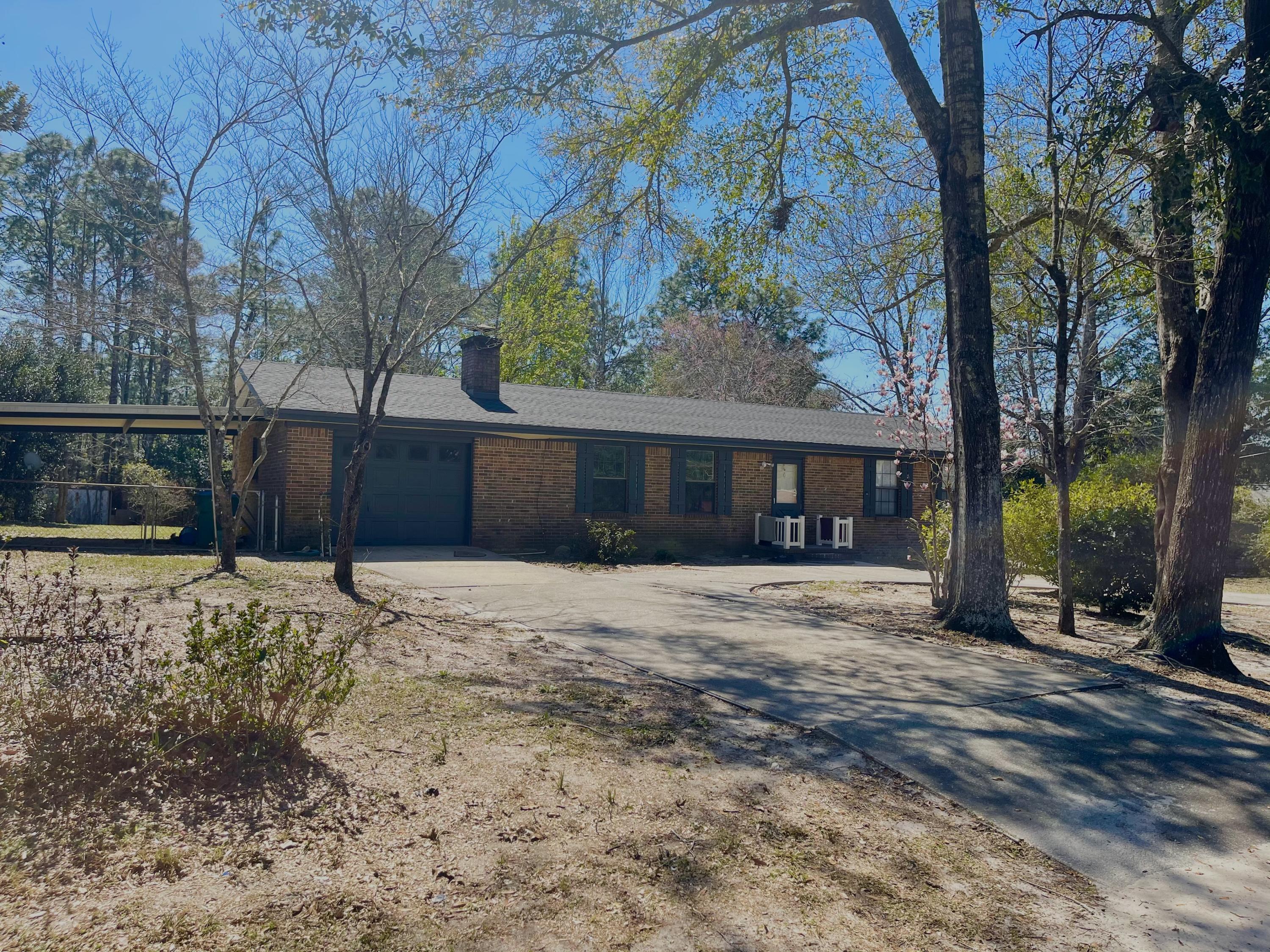 246 Ridge Lake Road Crestview, FL 32536 - Photo 1 of 17 a front view of a house with a yard