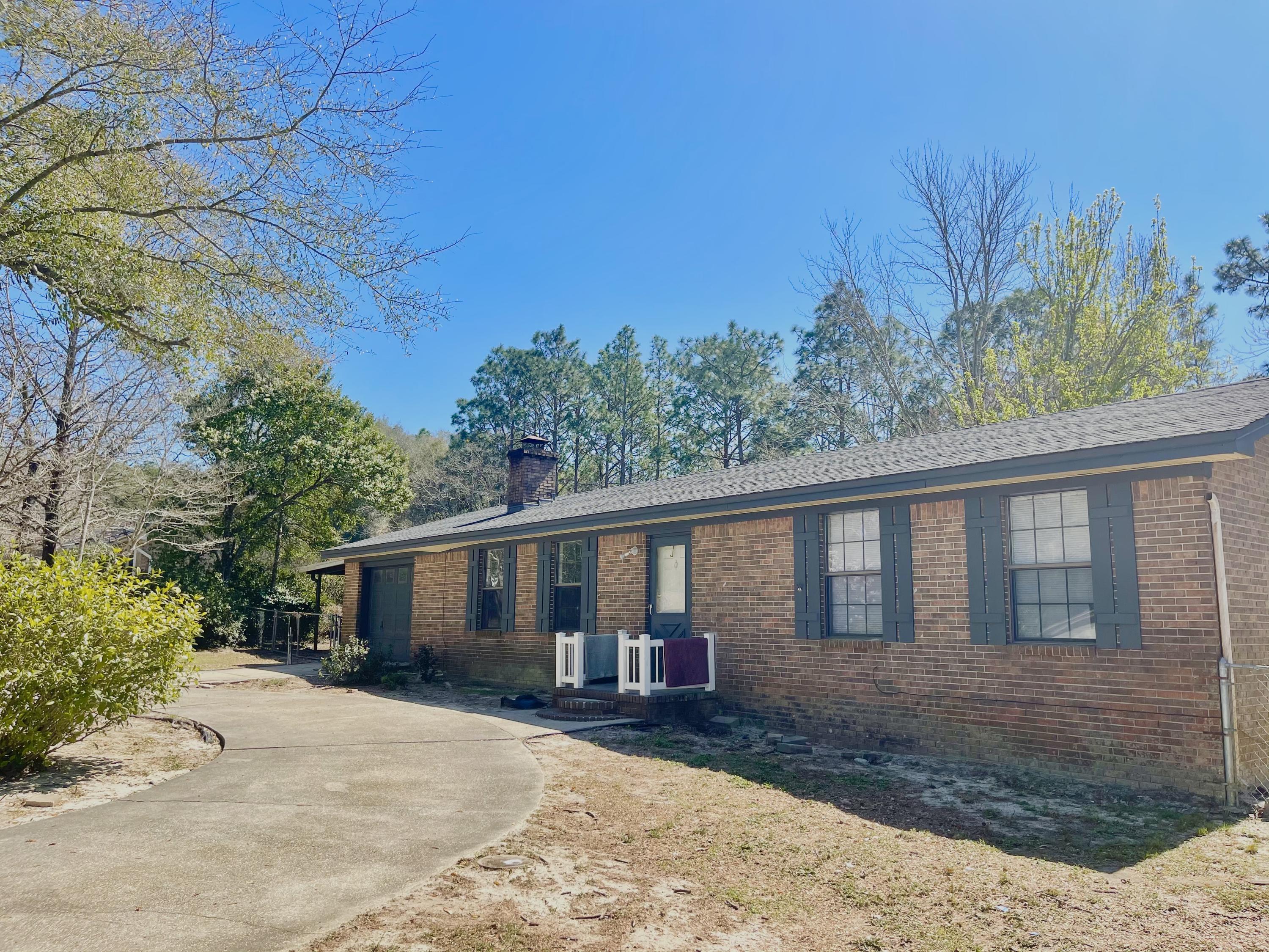 246 Ridge Lake Road Crestview, FL 32536 - Photo 2 of 17 front view of a house with a yard