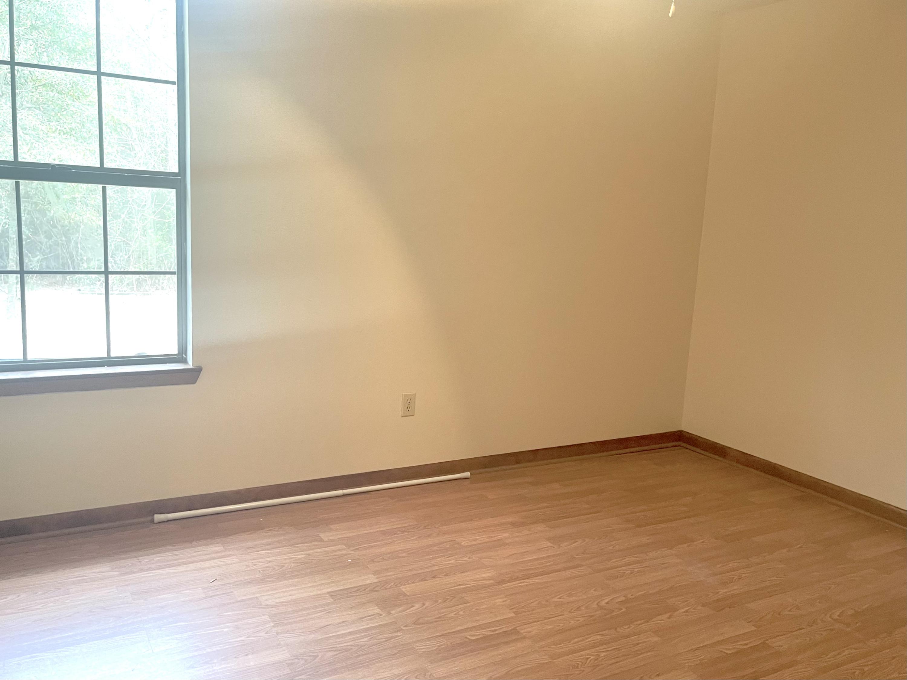 246 Ridge Lake Road Crestview, FL 32536 - Photo 16 of 17 an empty room with a empty space and a window