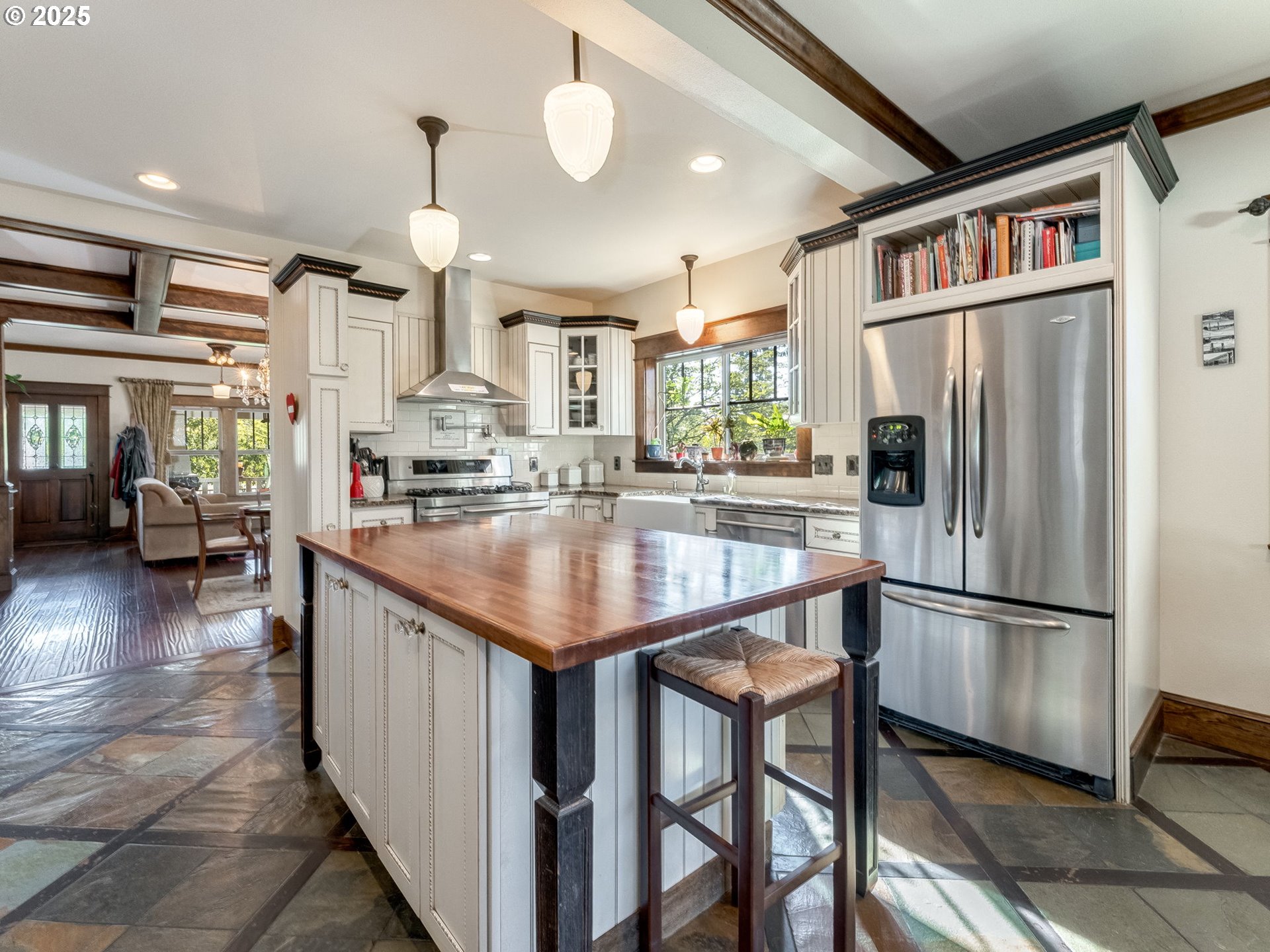 2400 H Street Vancouver, WA 98663 - Photo 15 of 48 a kitchen with stainless steel appliances granite countertop a refrigerator a stove and a sink with wooden floor