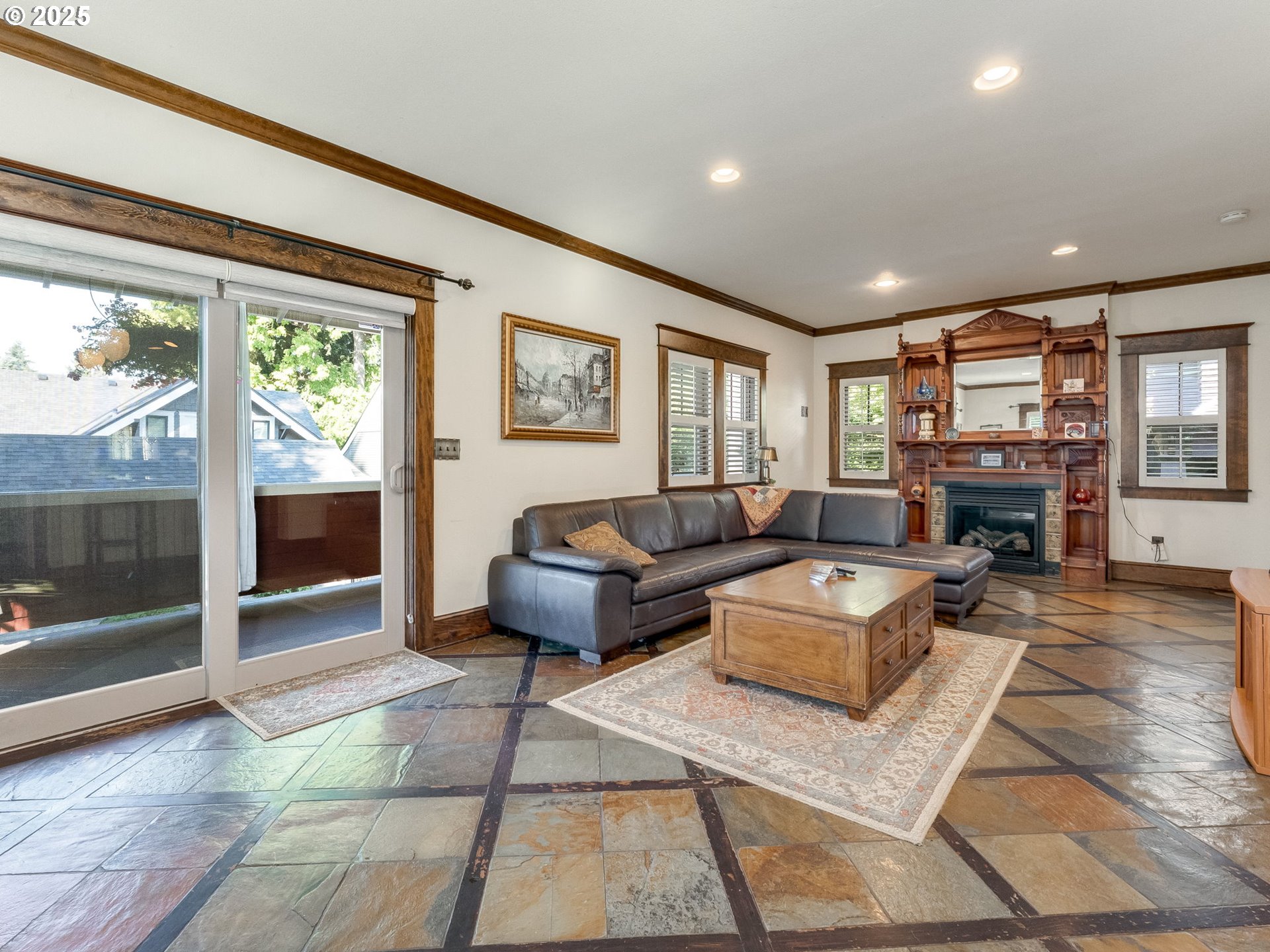 2400 H Street Vancouver, WA 98663 - Photo 23 of 48 a living room with furniture a fireplace and a floor to ceiling window