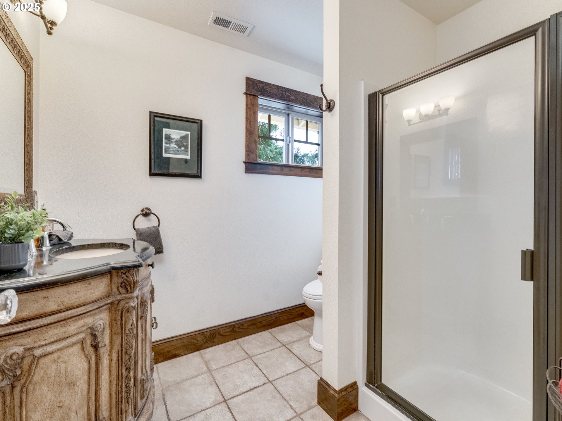 2400 H Street Vancouver, WA 98663 - Photo 35 of 48 a view of a bathroom with a sink and a mirror