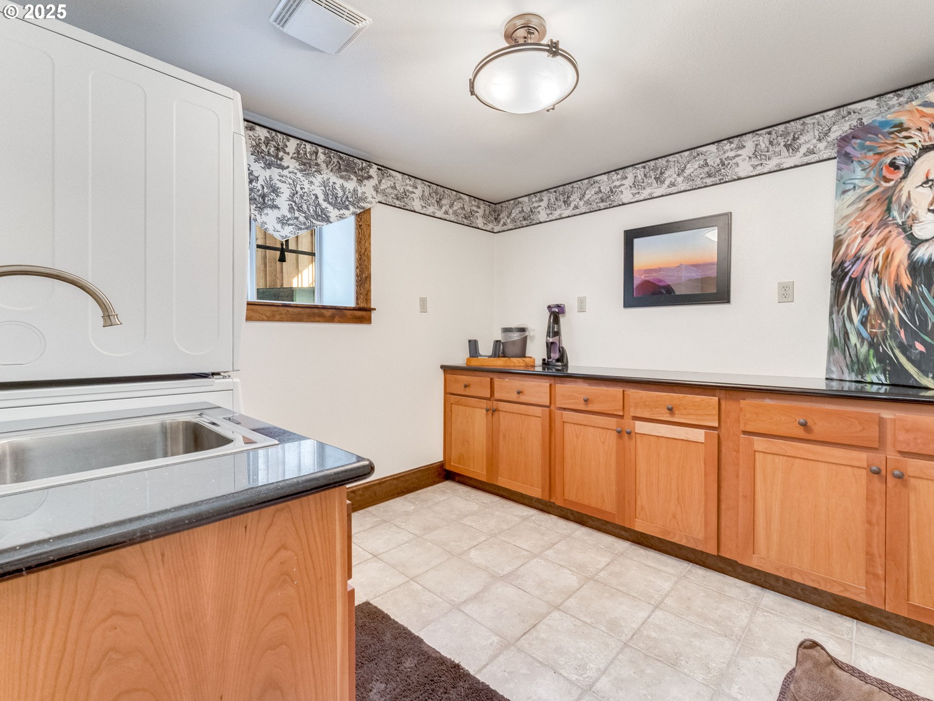 2400 H Street Vancouver, WA 98663 - Photo 43 of 48 a kitchen with granite countertop a sink and a stove top oven