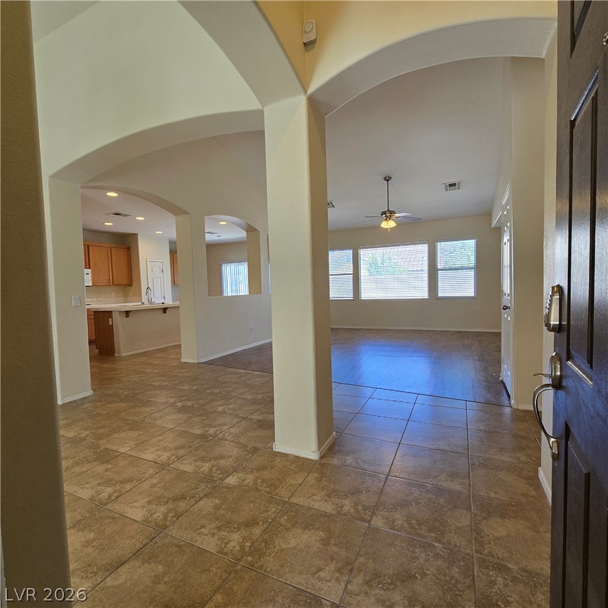 9234 Kingston Road Henderson, NV 89074 - Photo 9 of 38 Step inside to a generous entry featuring an inviting open-concept layout.