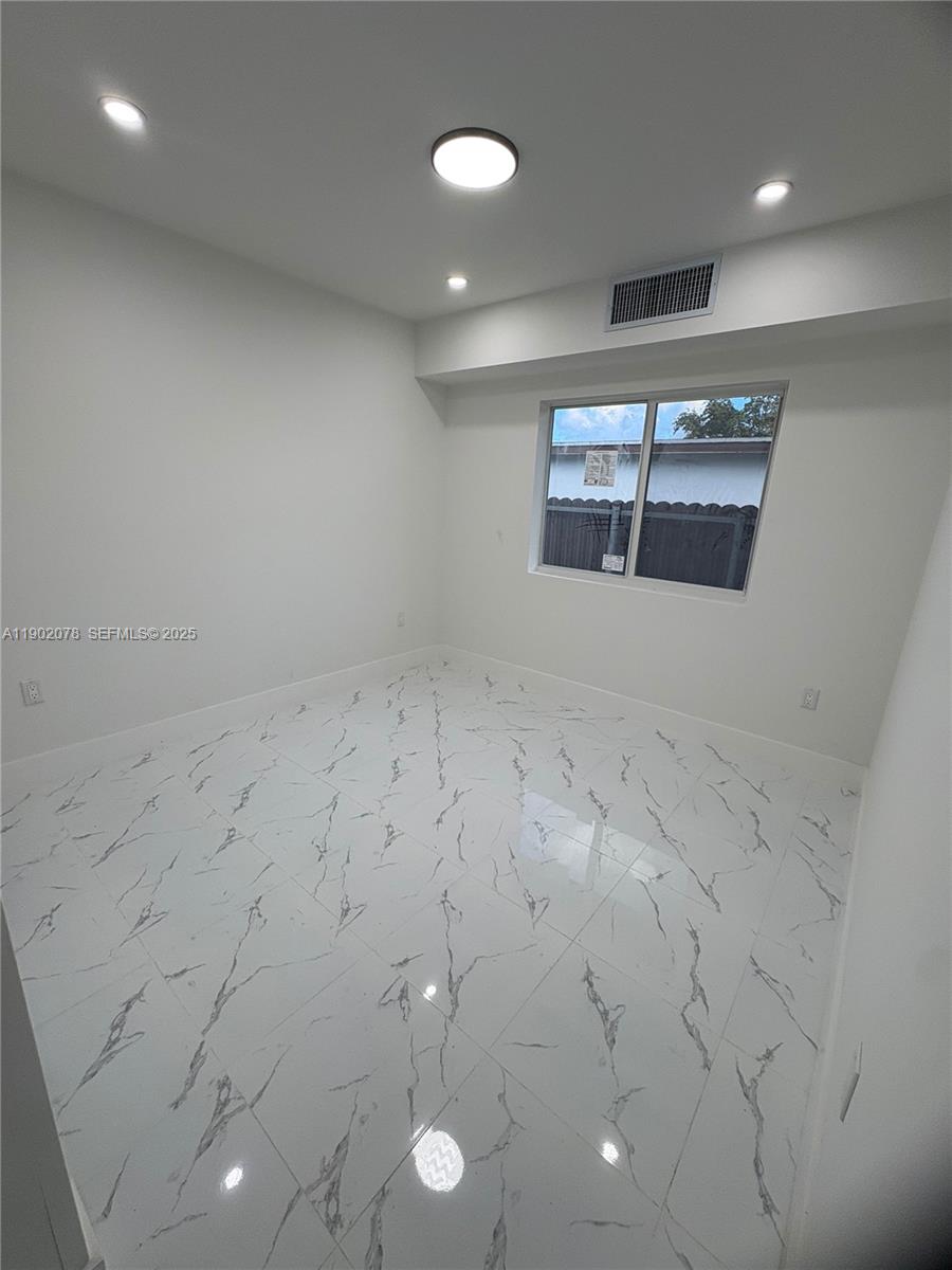 10020 Southwest 171st Street Miami, FL 33157 - Photo 12 of 18 an empty room with a empty space