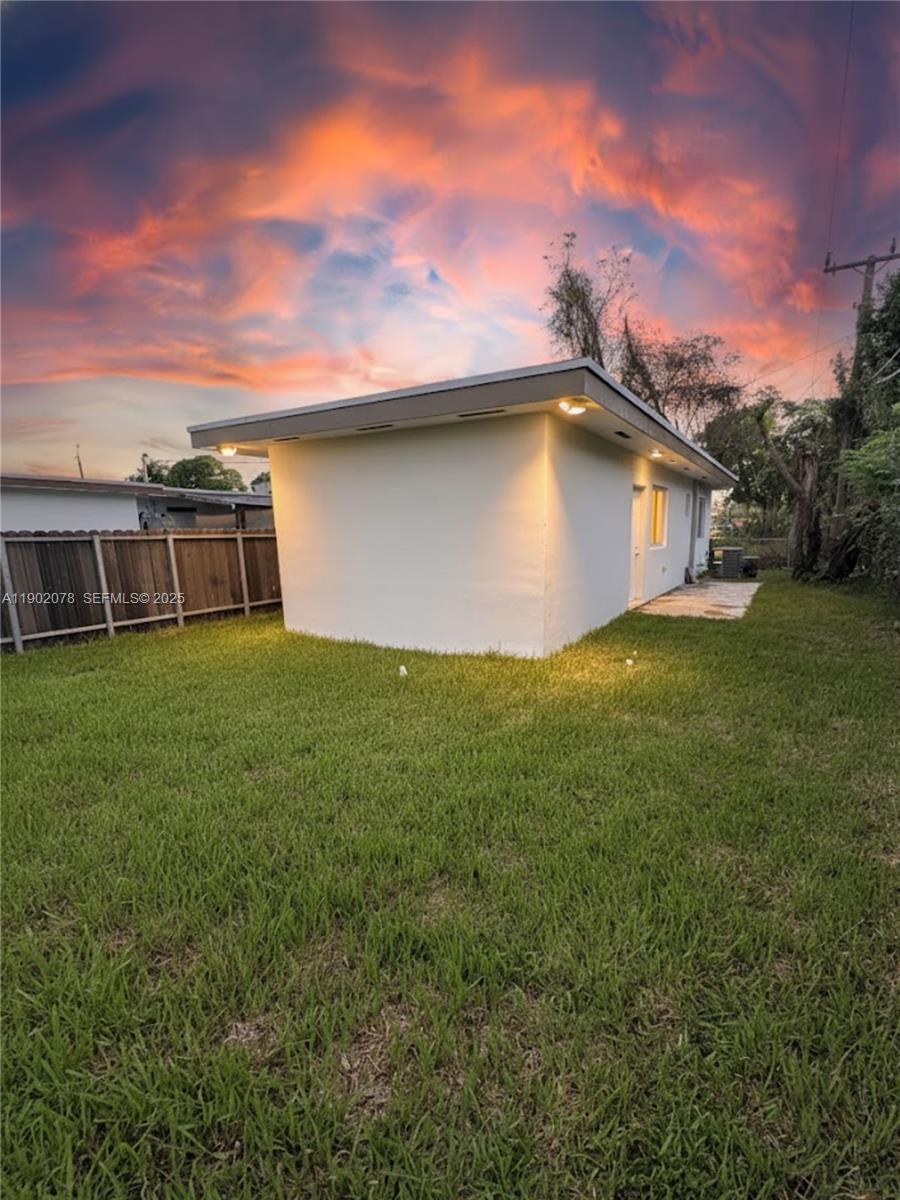 10020 Southwest 171st Street Miami, FL 33157 - Photo 2 of 18 a view of a house with a yard