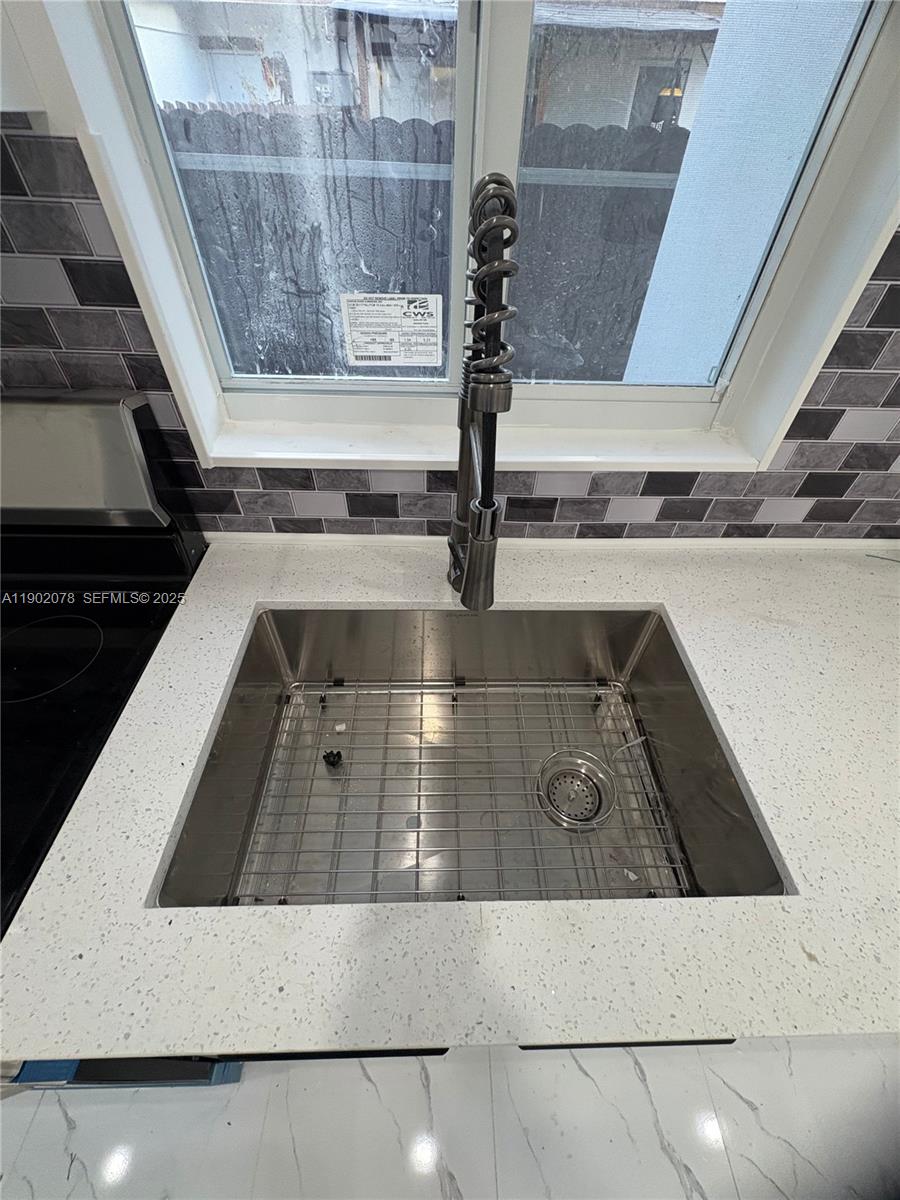 10020 Southwest 171st Street Miami, FL 33157 - Photo 6 of 18 a view of a kitchen