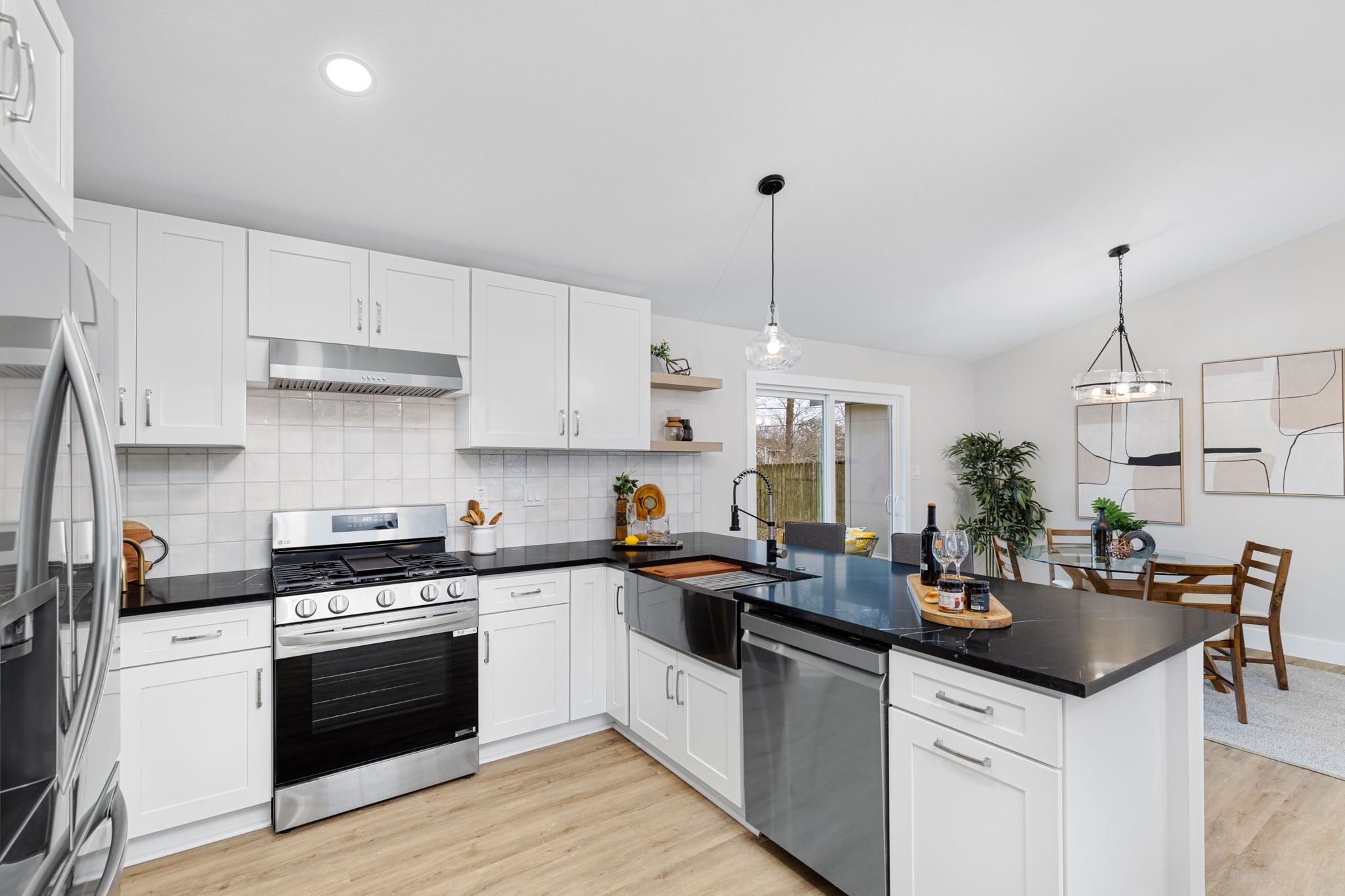 5605 Overbrook Drive Austin, TX 78723 - Photo 15 of 37 a kitchen with granite countertop a sink stainless steel appliances and cabinets