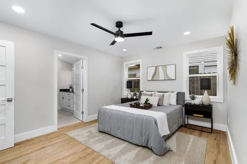 a bedroom with a bed and window