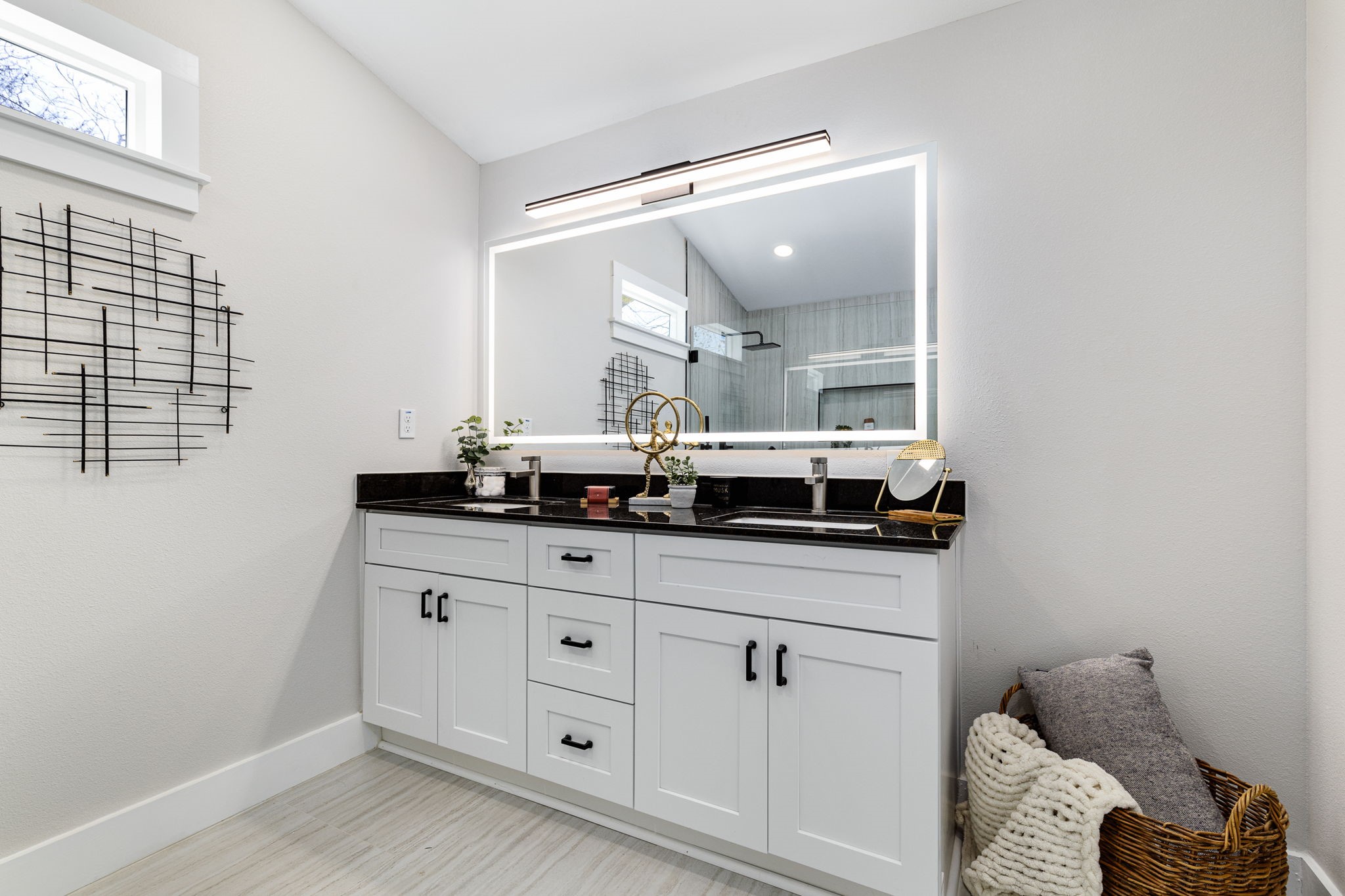 5605 Overbrook Drive Austin, TX 78723 - Photo 17 of 37 a bathroom with a double vanity sink and mirror