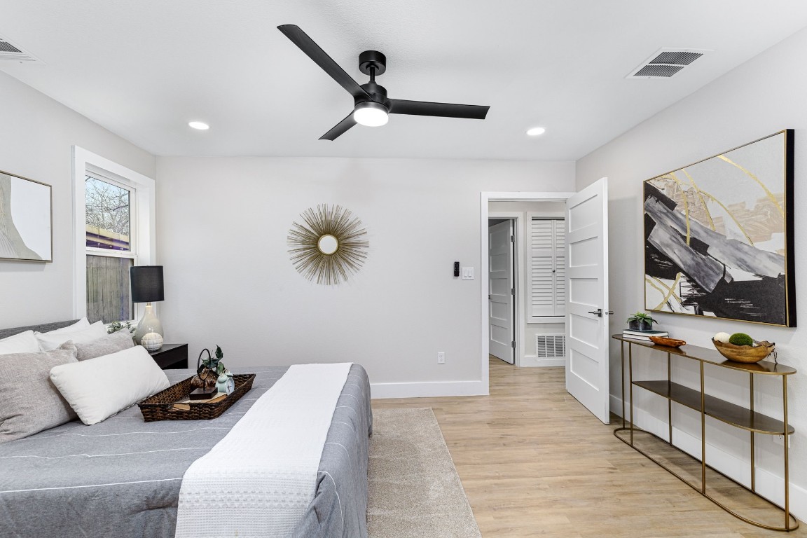 5605 Overbrook Drive Austin, TX 78723 - Photo 20 of 37 a bedroom with furniture and a large mirror