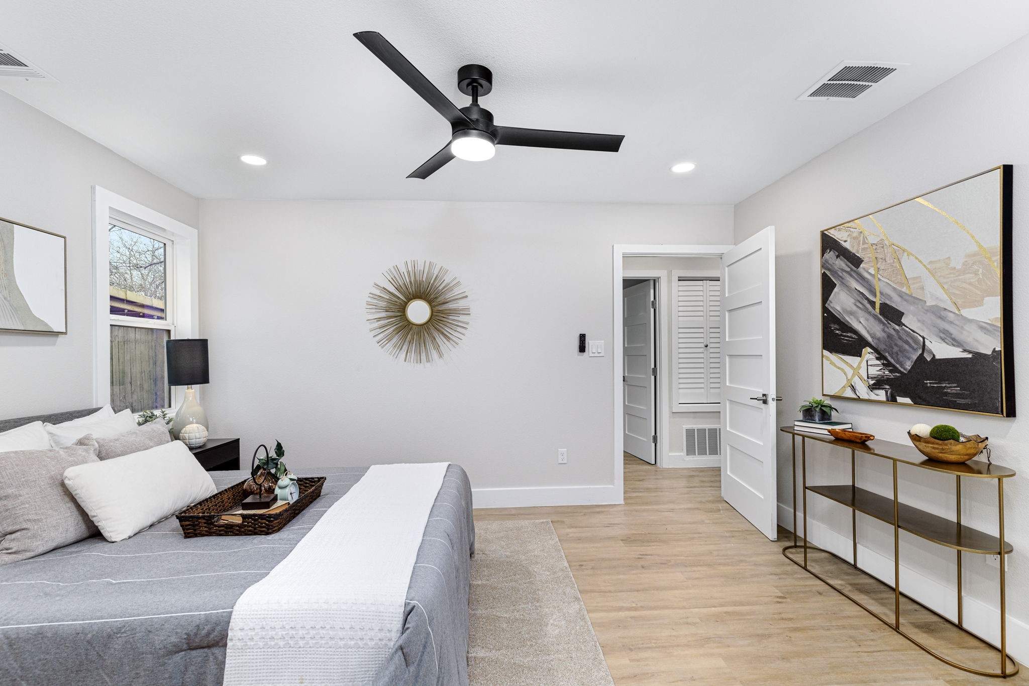 5605 Overbrook Drive Austin, TX 78723 - Photo 20 of 37 a bedroom with furniture and a large mirror