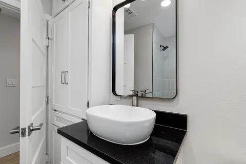 a bathroom with a sink and a mirror