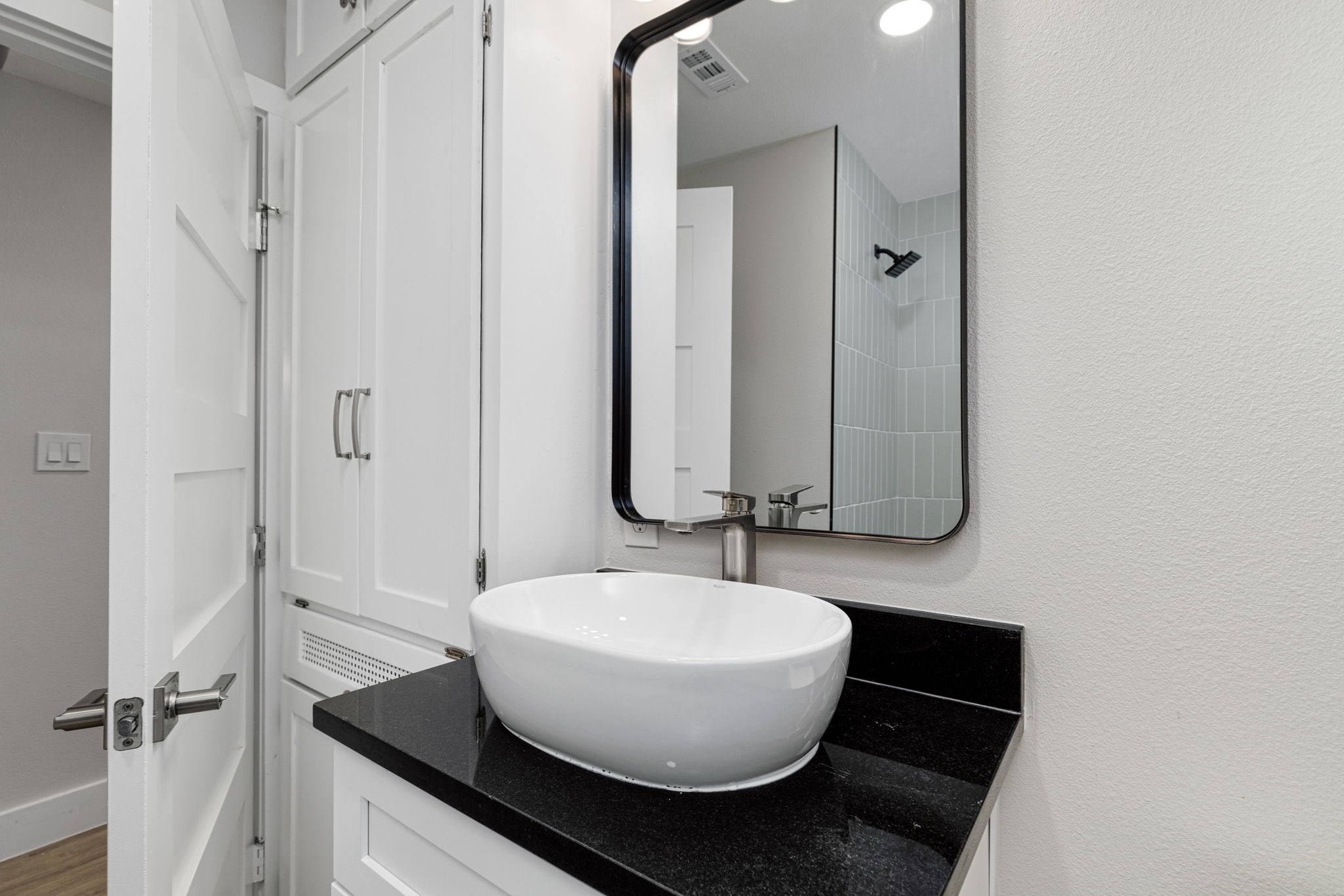 5605 Overbrook Drive Austin, TX 78723 - Photo 27 of 37 a bathroom with a sink and a mirror