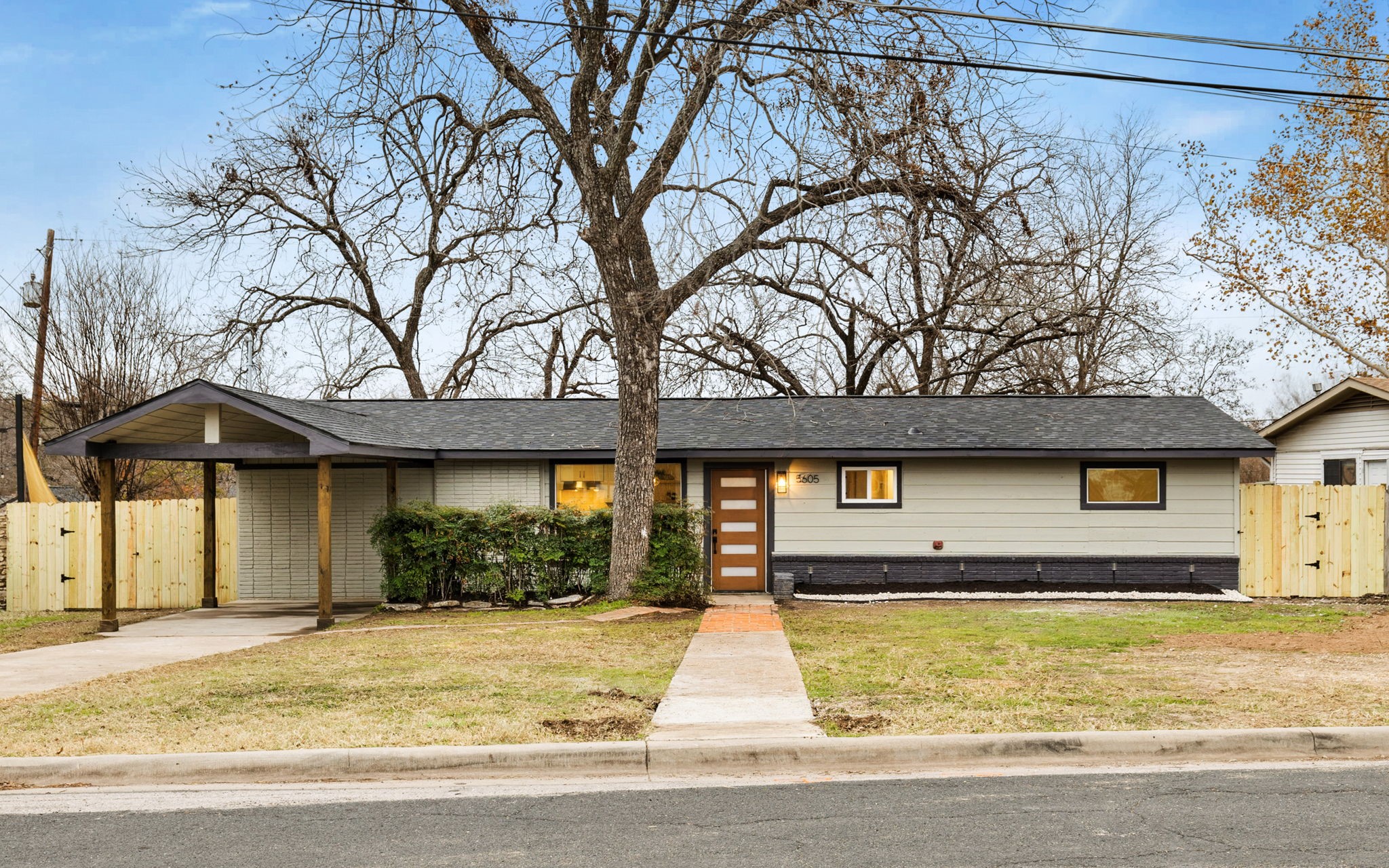 5605 Overbrook Drive Austin, TX 78723 - Photo 36 of 37 a view of yellow house with a yard and potted plants