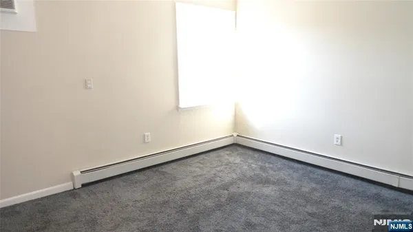 an empty room with a bench