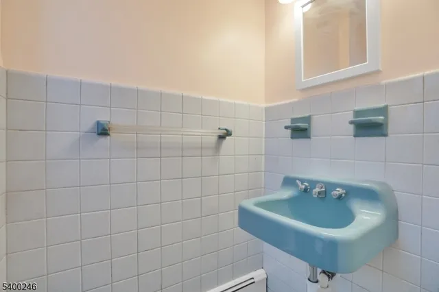 a bathroom with a sink and mirror