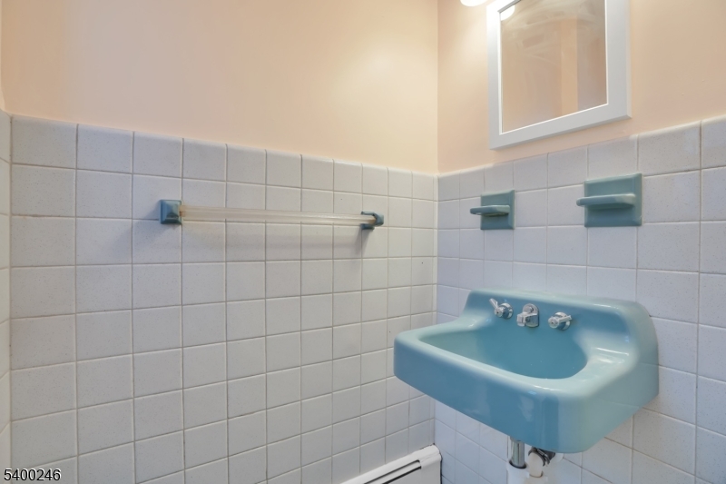 726 Gates Terrace, Unit 2 Union, NJ 07083 - Photo 19 of 25 a bathroom with a sink and mirror