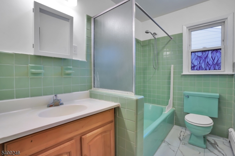 726 Gates Terrace, Unit 2 Union, NJ 07083 - Photo 22 of 25 a bathroom with a sink a toilet and shower