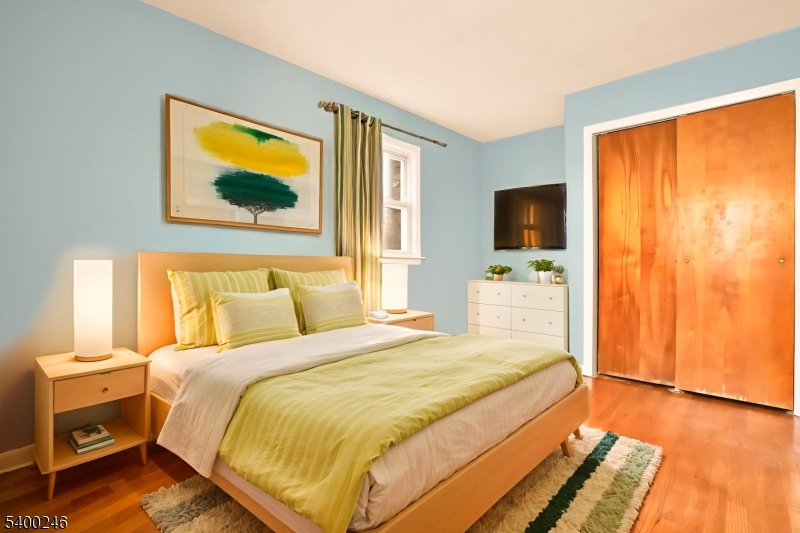 726 Gates Terrace, Unit 2 Union, NJ 07083 - Photo 3 of 25 a bedroom with a bed and a flat screen tv