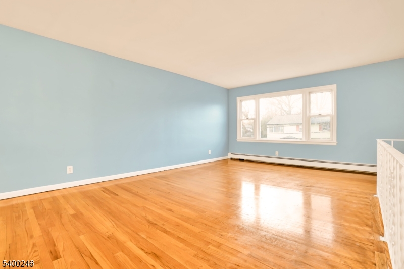 726 Gates Terrace, Unit 2 Union, NJ 07083 - Photo 9 of 25 a view of empty room with wooden floor and fan