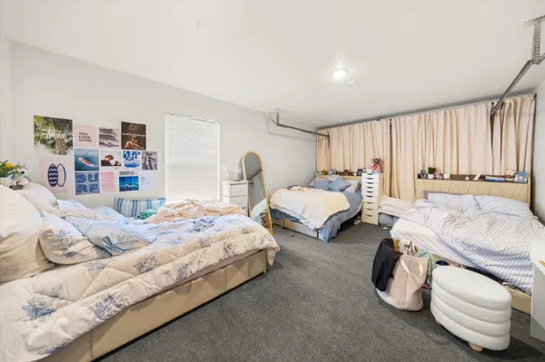 a bedroom with bed and a couch