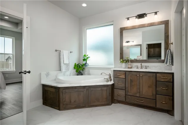 a bedroom with a bed lamps and window