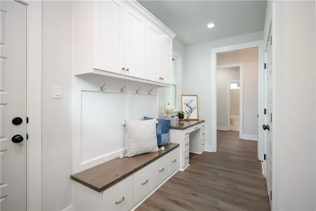 an empty room with windows and closet