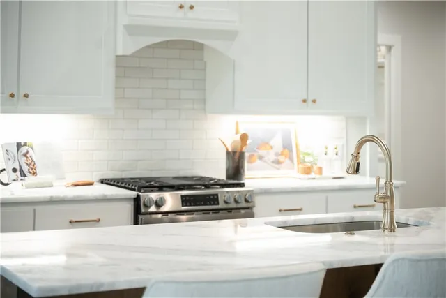 a kitchen with a sink and cabinets