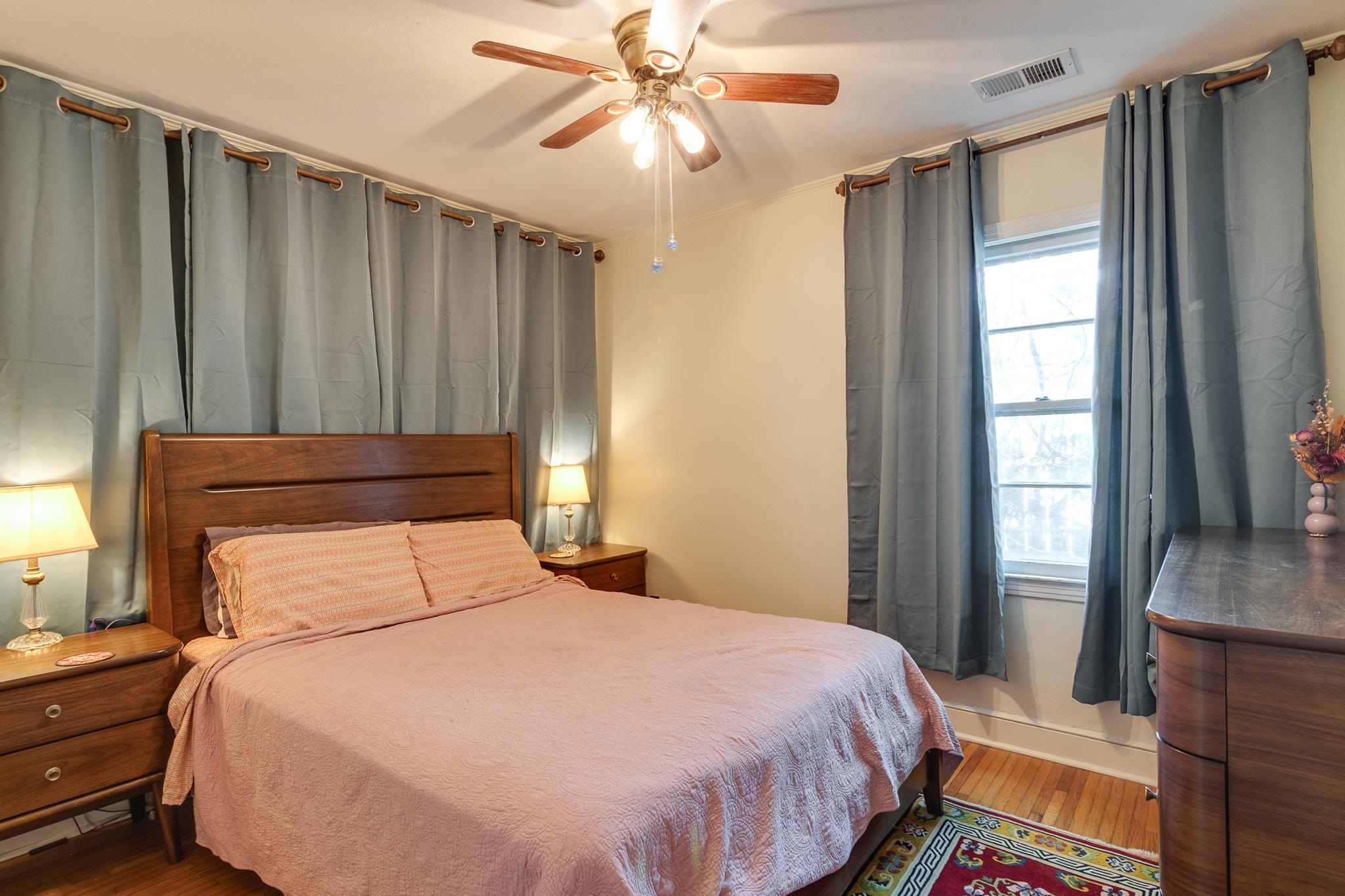 4661 Lynn Road Memphis, TN 38122 - Photo 19 of 32 a bedroom with a bed and a chandelier