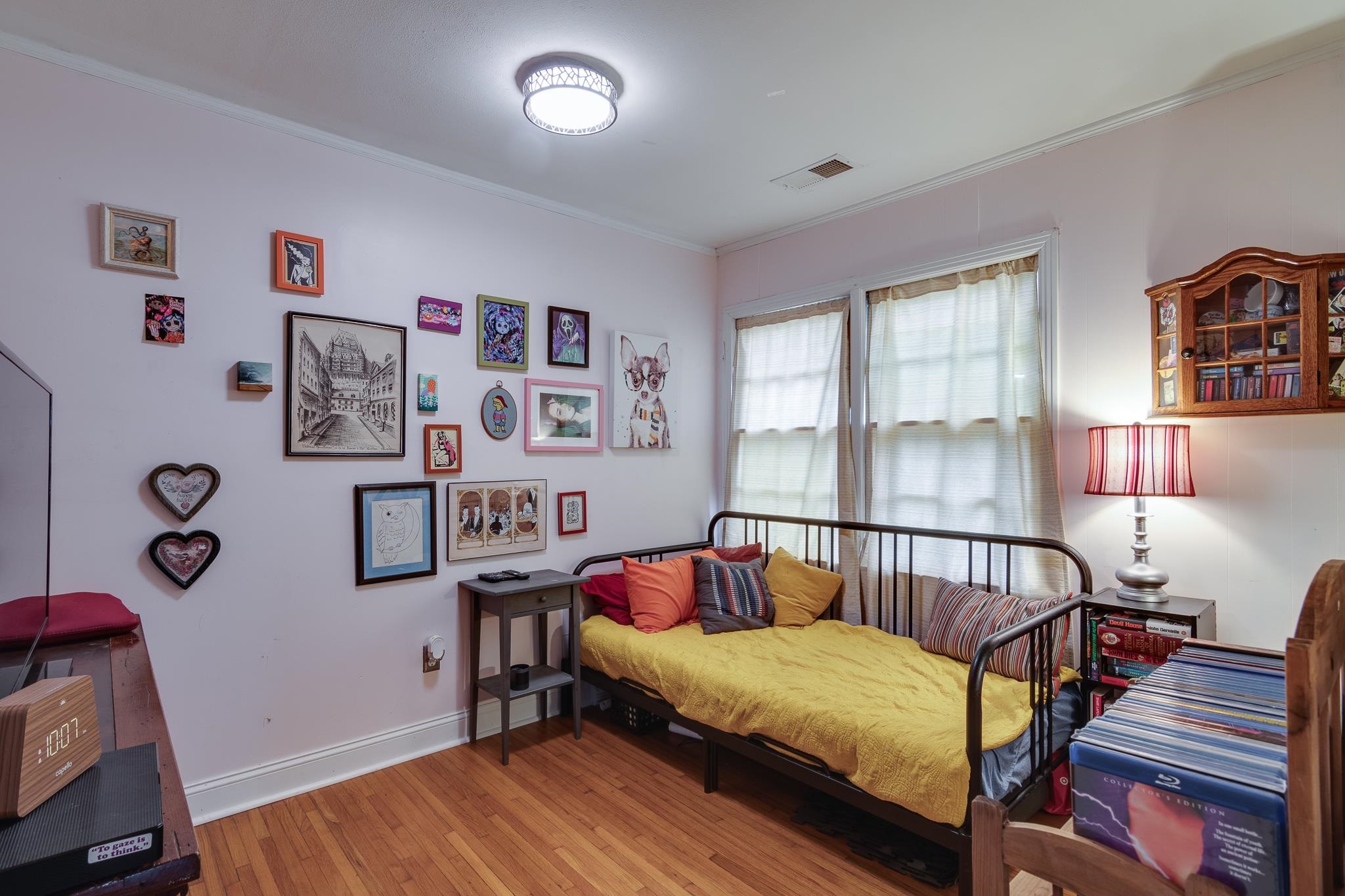 4661 Lynn Road Memphis, TN 38122 - Photo 20 of 32 a bedroom with furniture and wooden floor