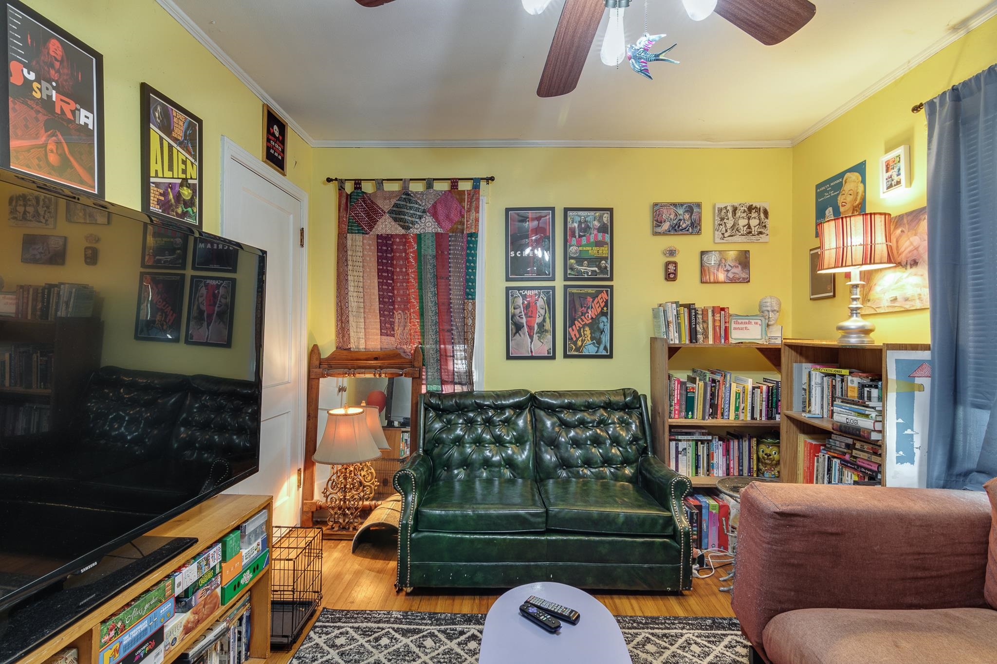4661 Lynn Road Memphis, TN 38122 - Photo 23 of 32 a living room with couch a bookshelf and a window