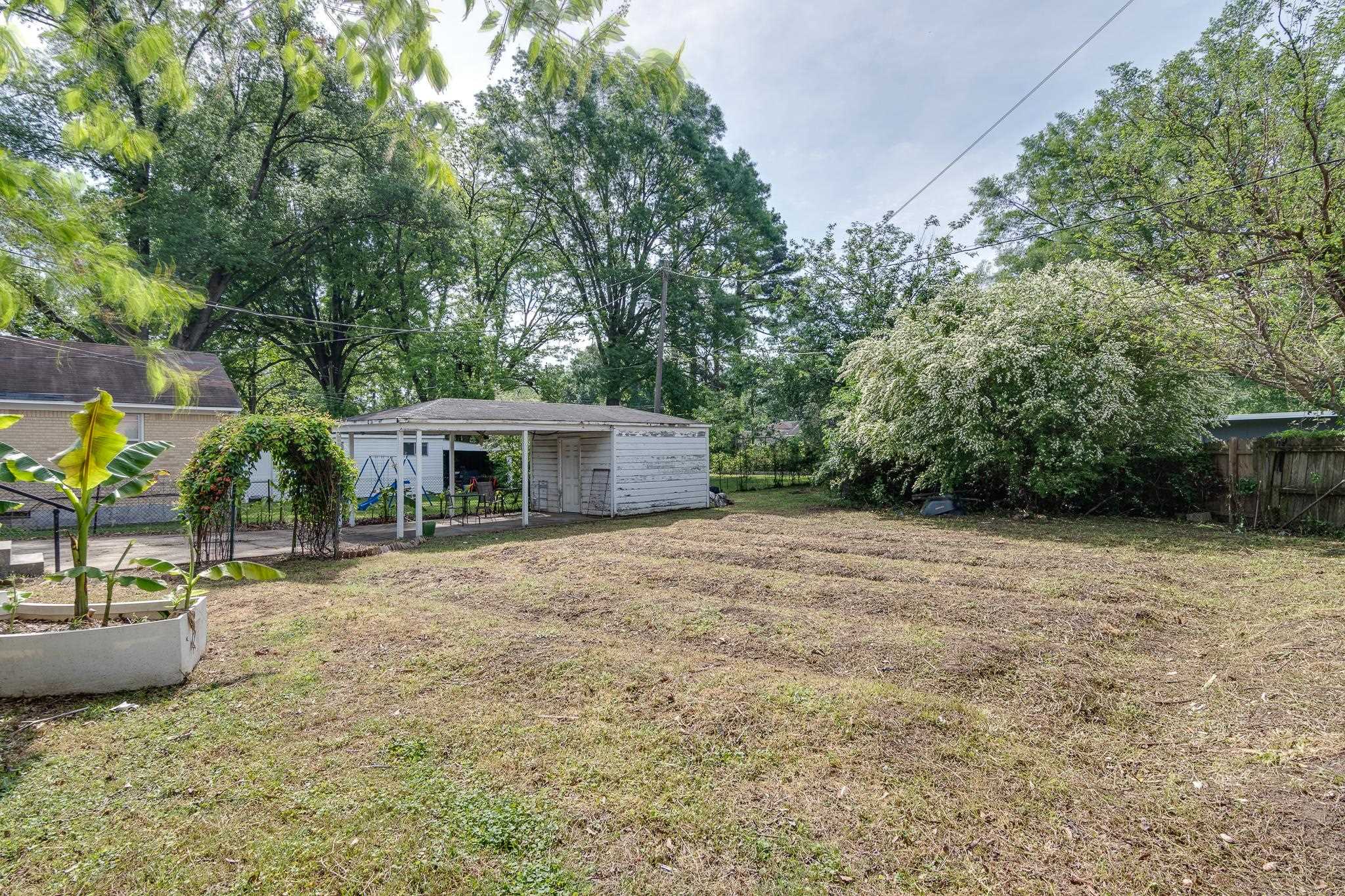 4661 Lynn Road Memphis, TN 38122 - Photo 29 of 32 a pathway of a house with a yard