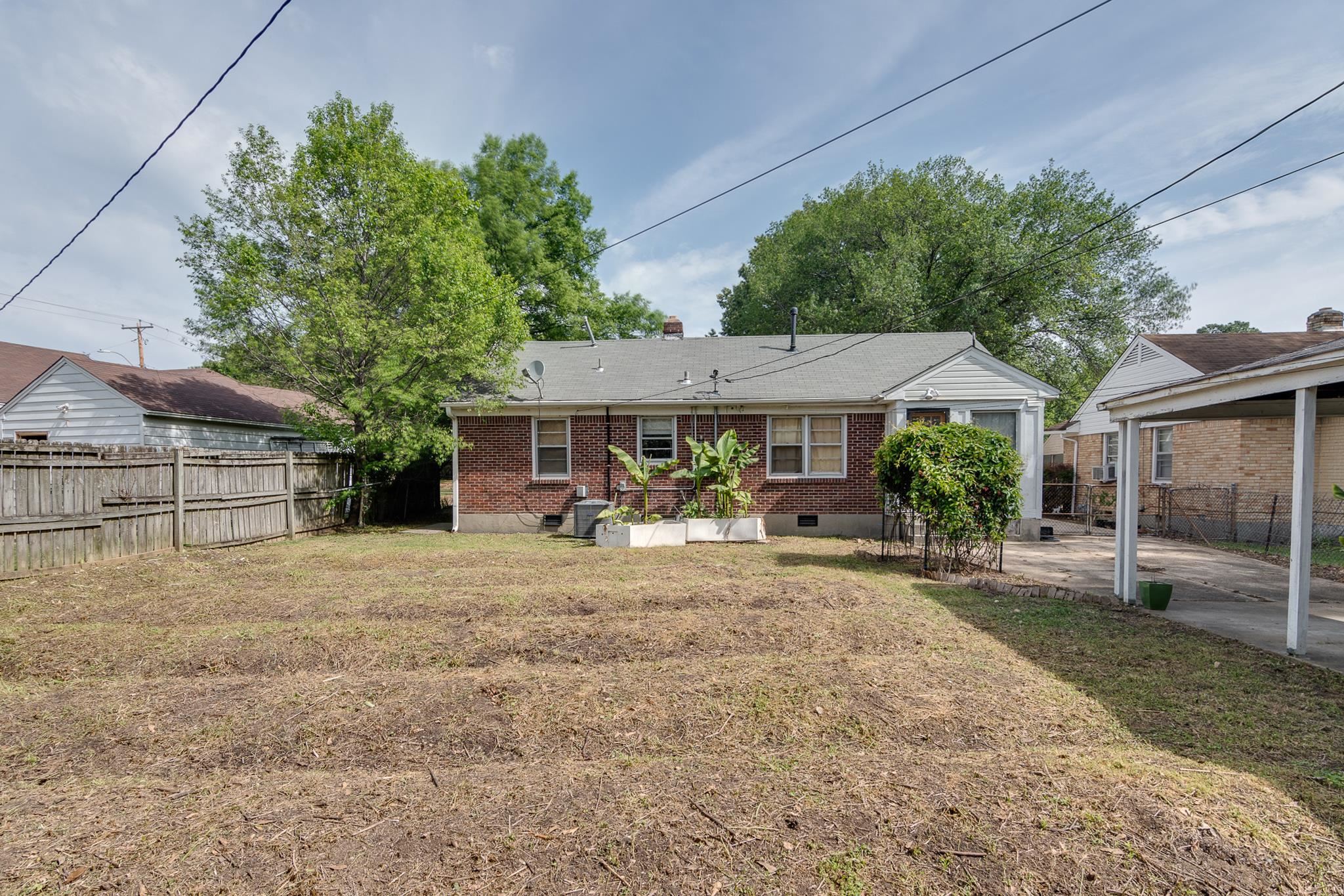 4661 Lynn Road Memphis, TN 38122 - Photo 30 of 32 a view of a house with backyard and sitting area