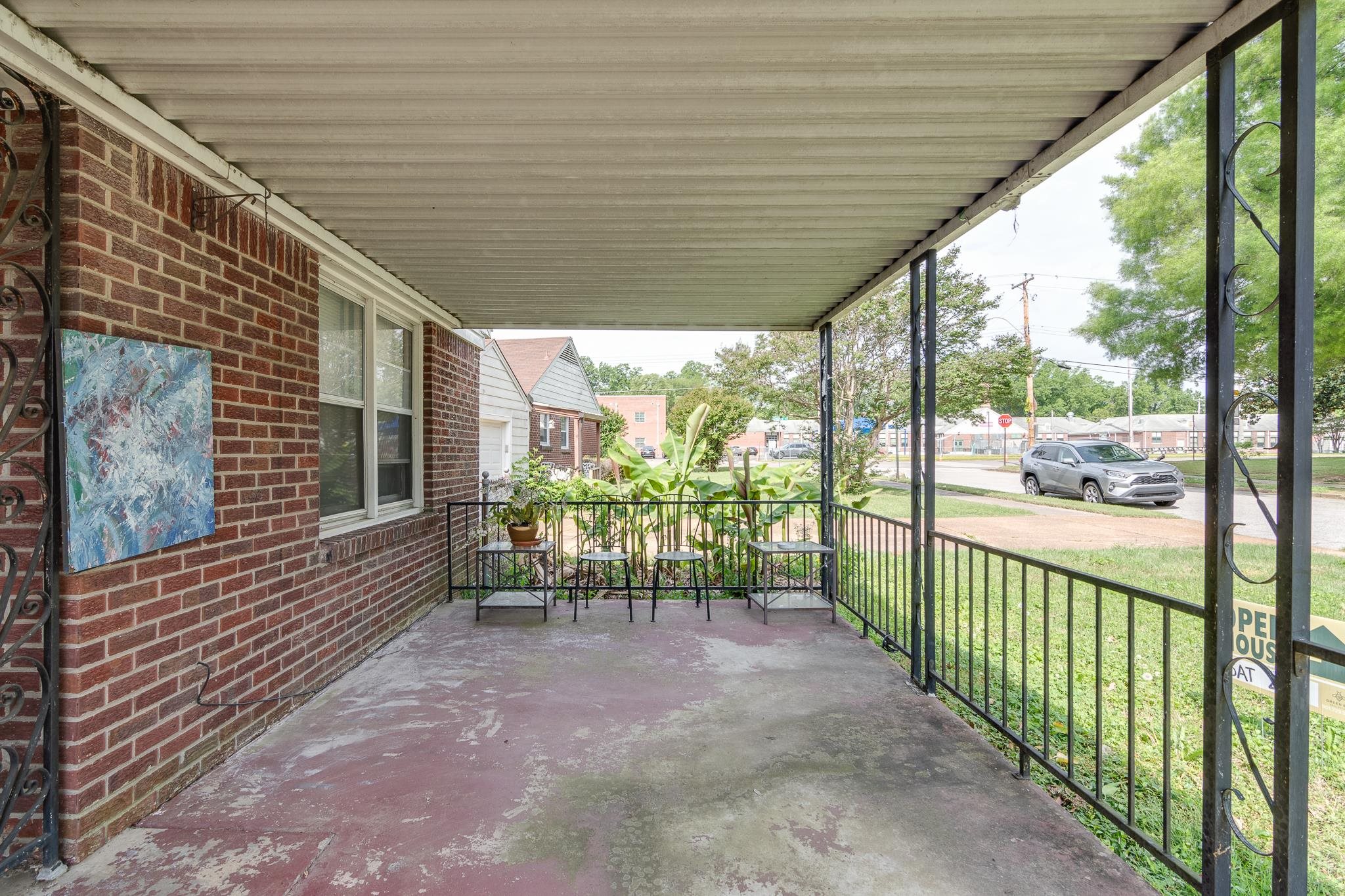4661 Lynn Road Memphis, TN 38122 - Photo 4 of 32 a view of a porch with wooden floor and outdoor space