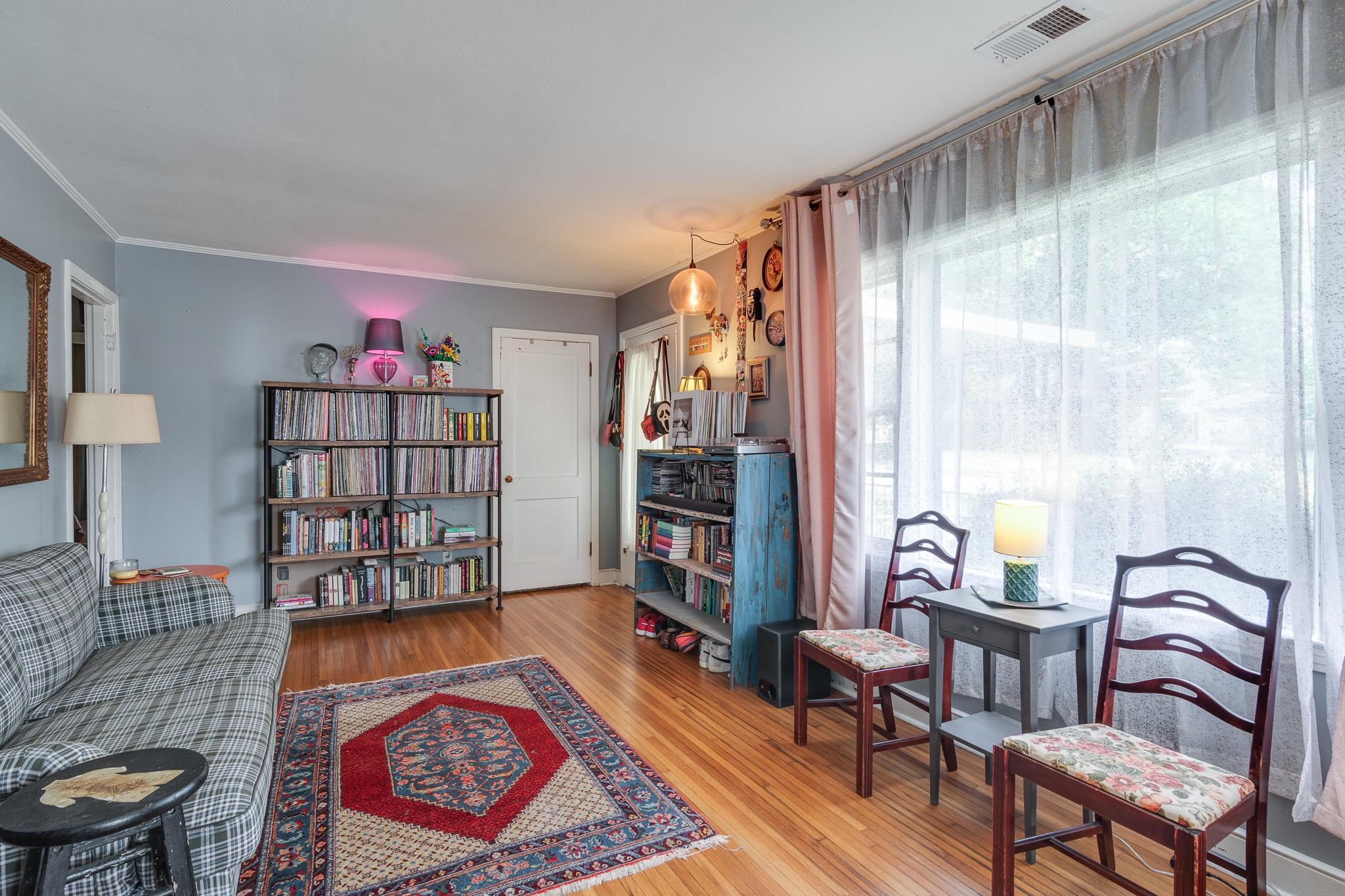 4661 Lynn Road Memphis, TN 38122 - Photo 8 of 32 a living room with furniture a bookshelf and a window